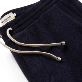 Material shot of The Weekend Pant in Navy Boiled Wool showing drawstrings