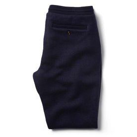 Flatlay of The Weekend Pant in Navy Boiled Wool folded from the back