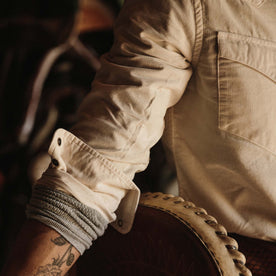 fit model wearing the shirt with the sleeves rolled up
