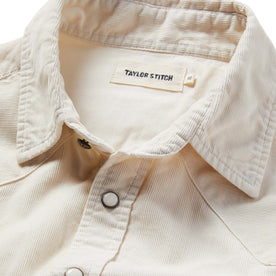 material shot of the shirt with the collar open and unbuttoned