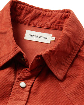 material shot of the shirt with the collar up close, unbuttoned, with the tag visible, Wovens by Taylor Stitch
