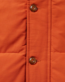 material shot of the placket and front buttons of The Whitney Parka in Dusty Orange, Outerwear by Taylor Stitch