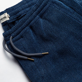 material shot of the drawstrings on The Apres Pant in Indigo Waffle