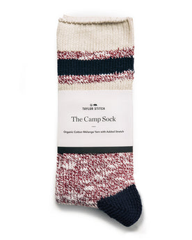 editorial image of the packaging on The Camp Sock in Heather Burgundy, Accessories by Taylor Stitch