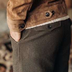 fit model with his hand in his pocket of The Carnegie Pant in Army Herringbone Wool
