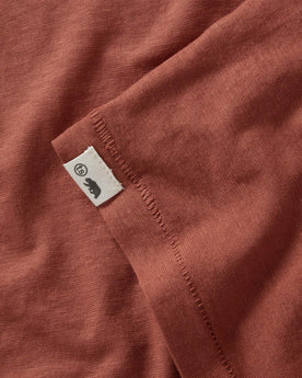 material shot of the logo patch  on The Cotton Hemp Long Sleeve in Engine, Knits by Taylor Stitch