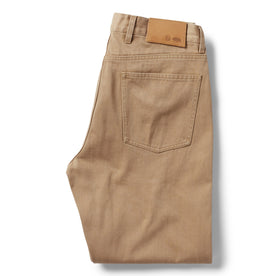 flatlay of The Democratic All Day Pant in Washed Tobacco Selvage, shown folded from back