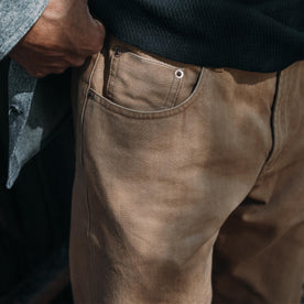 fit model showing the front pocket of The Democratic All Day Pant in Washed Tobacco Selvage
