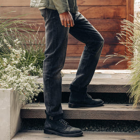 fit model walking up stairs in The Democratic Jean in Black 3-Month Wash Selvage