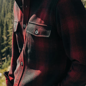 fit model showing off pockets on The Explorer Shirt in Cardinal Plaid