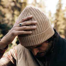 fit model adjusting The Fisherman Beanie in Camel