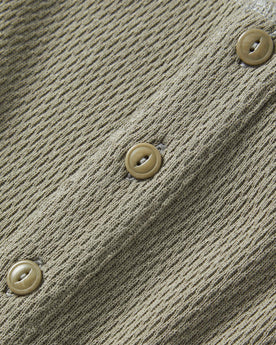 material shot of the buttons on The Heavy Bag Waffle Henley in Army, Knits by Taylor Stitch