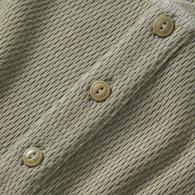 material shot of the buttons on The Heavy Bag Waffle Henley in Army