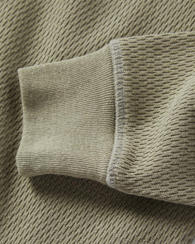 material shot of the sleeves on The Heavy Bag Waffle Henley in Army, Knits by Taylor Stitch