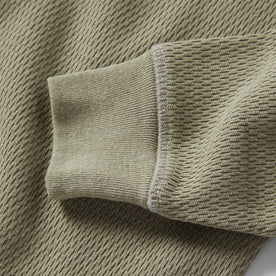 material shot of the sleeves on The Heavy Bag Waffle Henley in Army