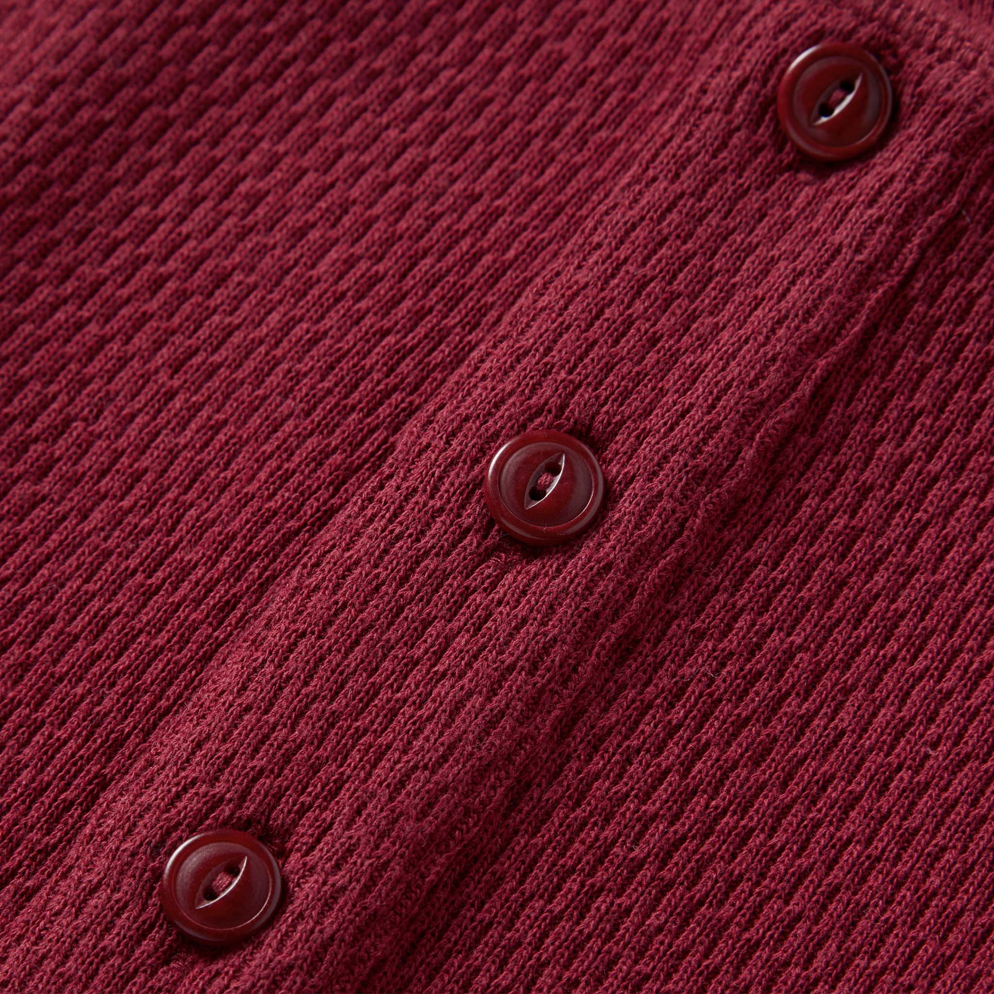 material shot of the buttons on The Heavy Bag Waffle Henley in Burgundy, Knits by Taylor Stitch