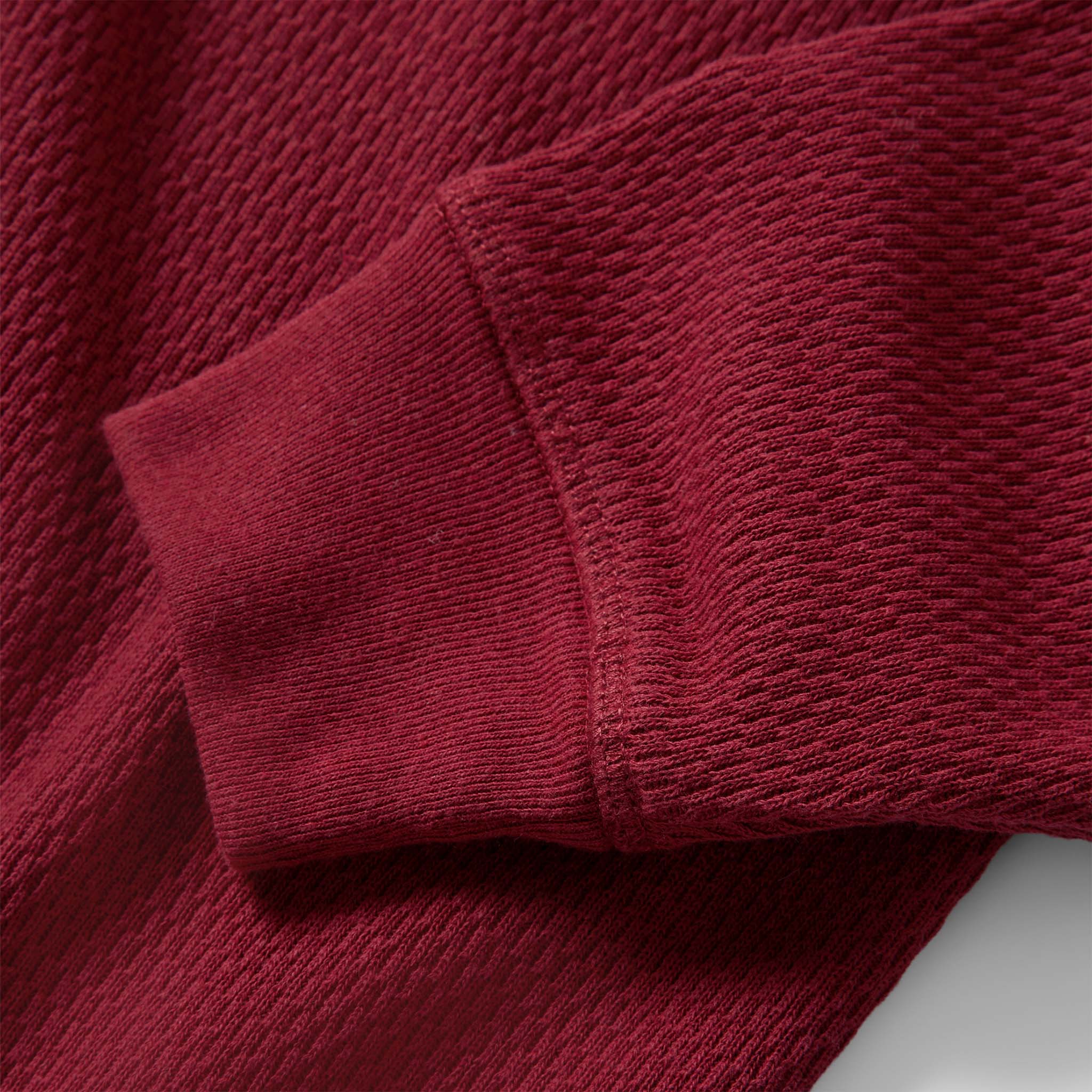 material shot of the sleeves on The Heavy Bag Waffle Henley in Burgundy, Knits by Taylor Stitch