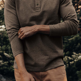 fit model adjusting sleeves on The Heavy Bag Henley in Walnut