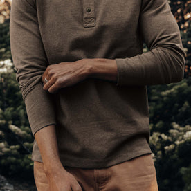 fit model adjusting sleeves on The Heavy Bag Henley in Walnut