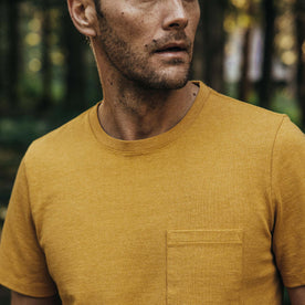 fit model showing pocket detail on The Heavy Bag Tee in Honey