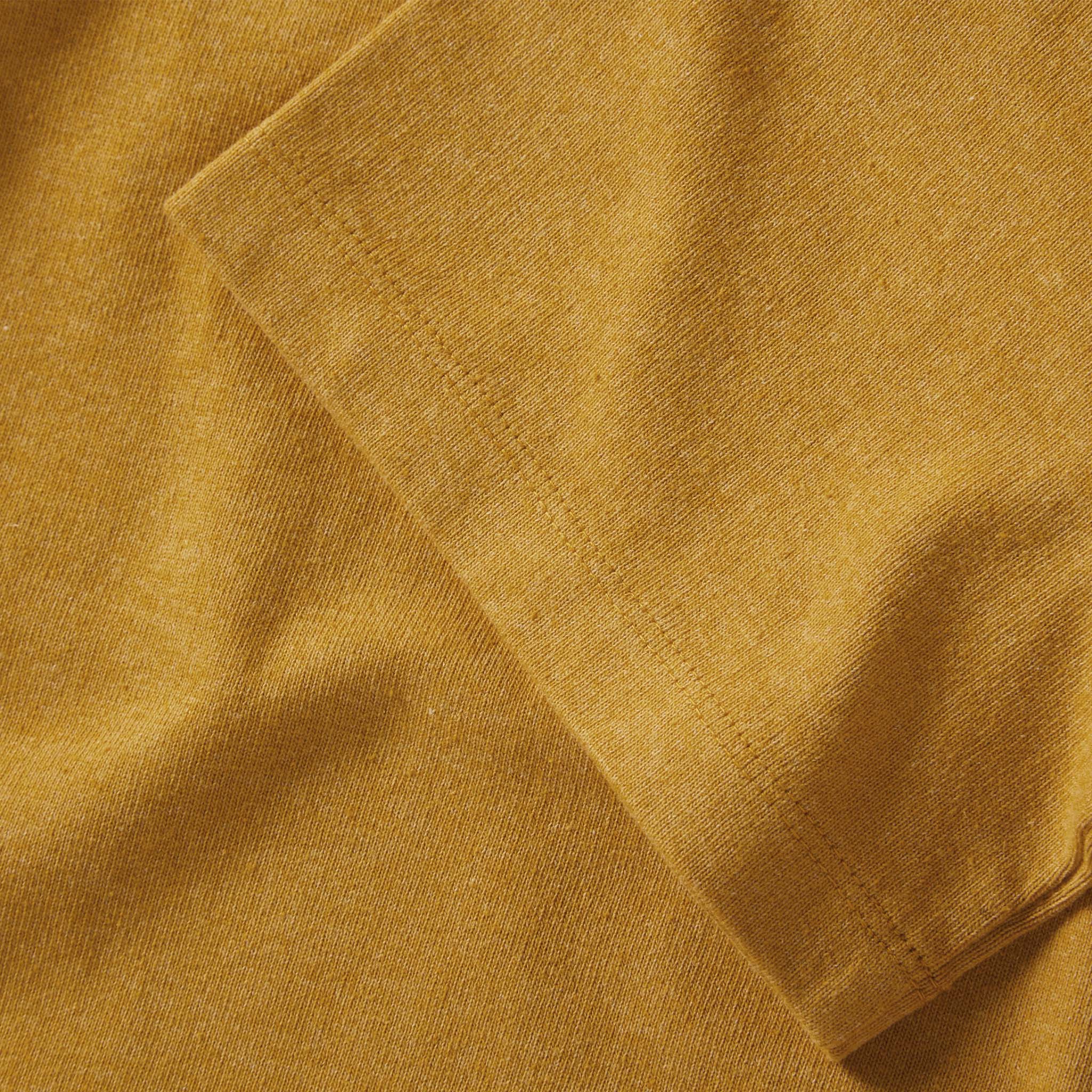 material shot of the sleeve on The Heavy Bag Tee in Honey, Knits by Taylor Stitch