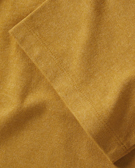 material shot of the sleeve on The Heavy Bag Tee in Honey, Knits by Taylor Stitch