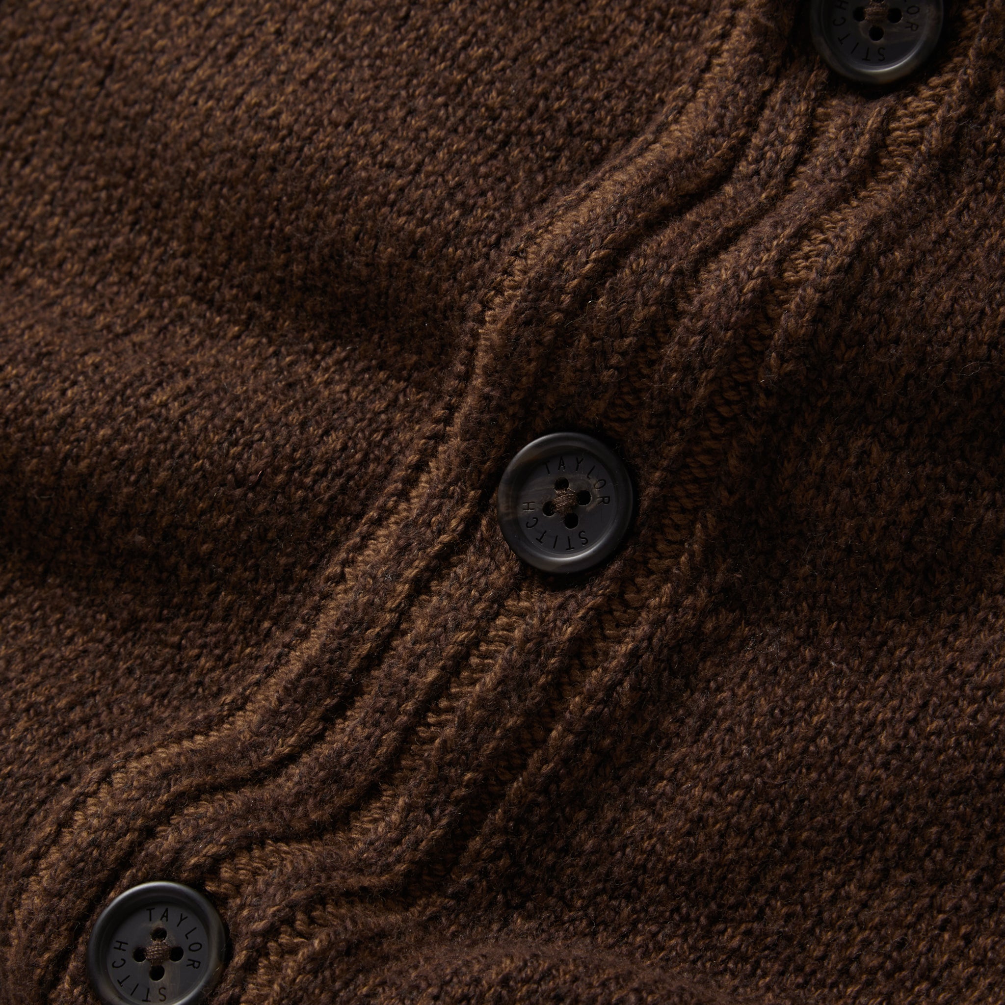 material shot of the buttons on The Headland Shawl Cardigan in Marled Chocolate, Knits by Taylor Stitch