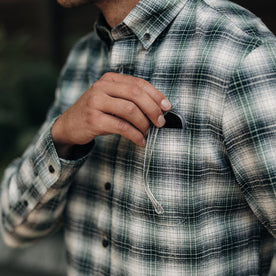 fit model putting sunglasses in the chest pocket of The Jack in Spruce Nep Plaid