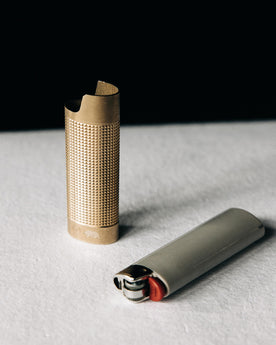 editorial image of the sleeve out of the lighter for The Lighter Sleeve in Brass, Accessories by Taylor Stitch