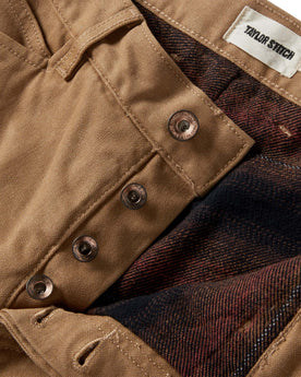 material shot of the button fly on The Lined Chore Pant in Tobacco Boss Duck, Bottoms by Taylor Stitch