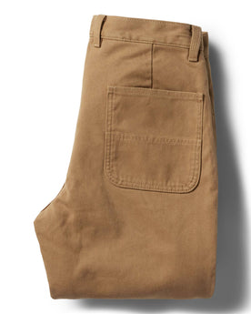 flatlay of the back of The Lined Chore Pant in Tobacco Boss Duck folded, Bottoms by Taylor Stitch