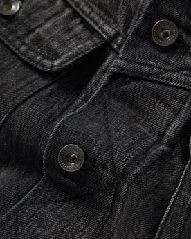 material shot of the buttons on The Long Haul Jacket in Black 3-Month Wash Selvage, Outerwear by Taylor Stitch