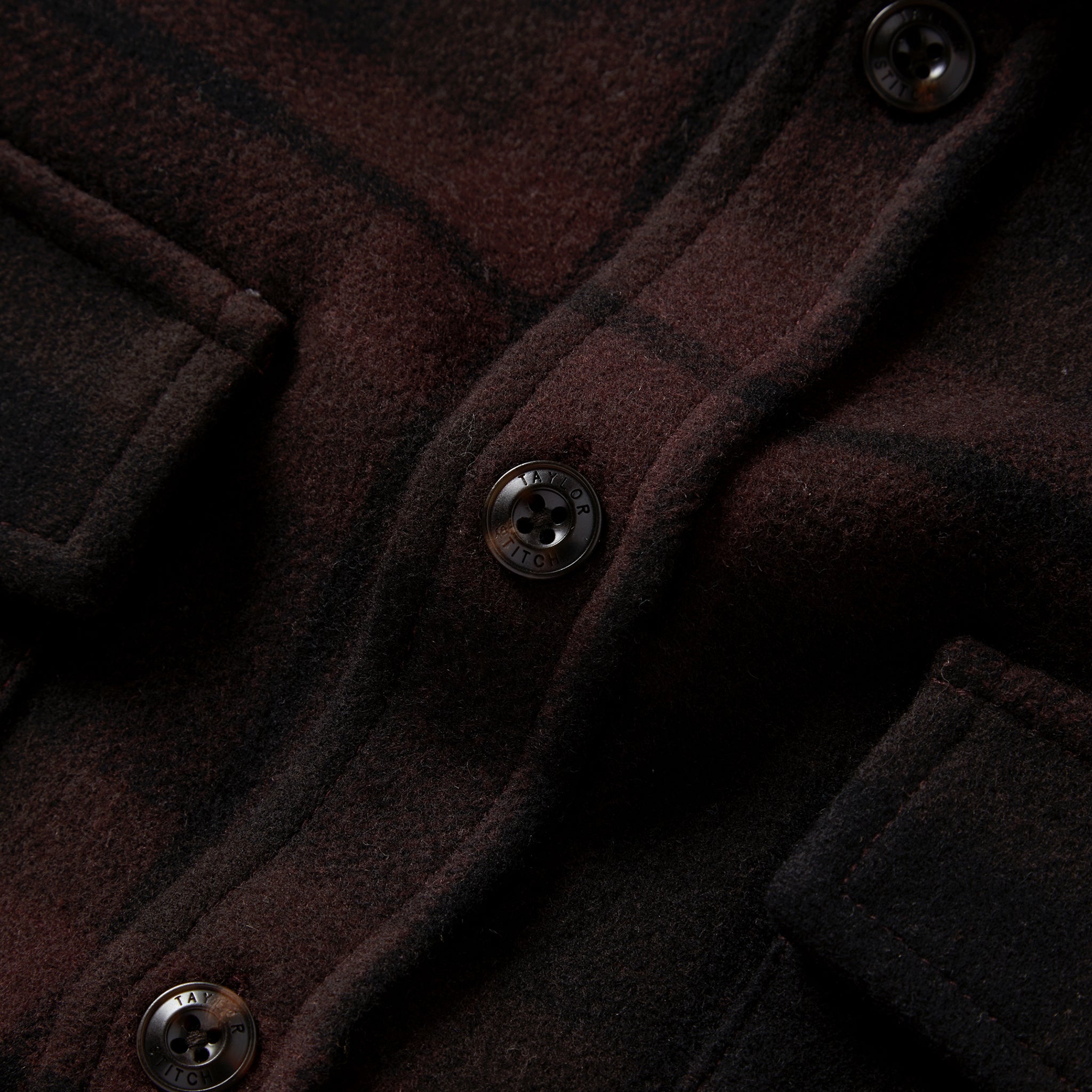 material shot of the buttons on The Maritime Shirt Jacket in Carson Plaid, Wovens by Taylor Stitch