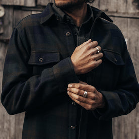 fit model adjusting the cuff on The Maritime Shirt Jacket in Pike Plaid