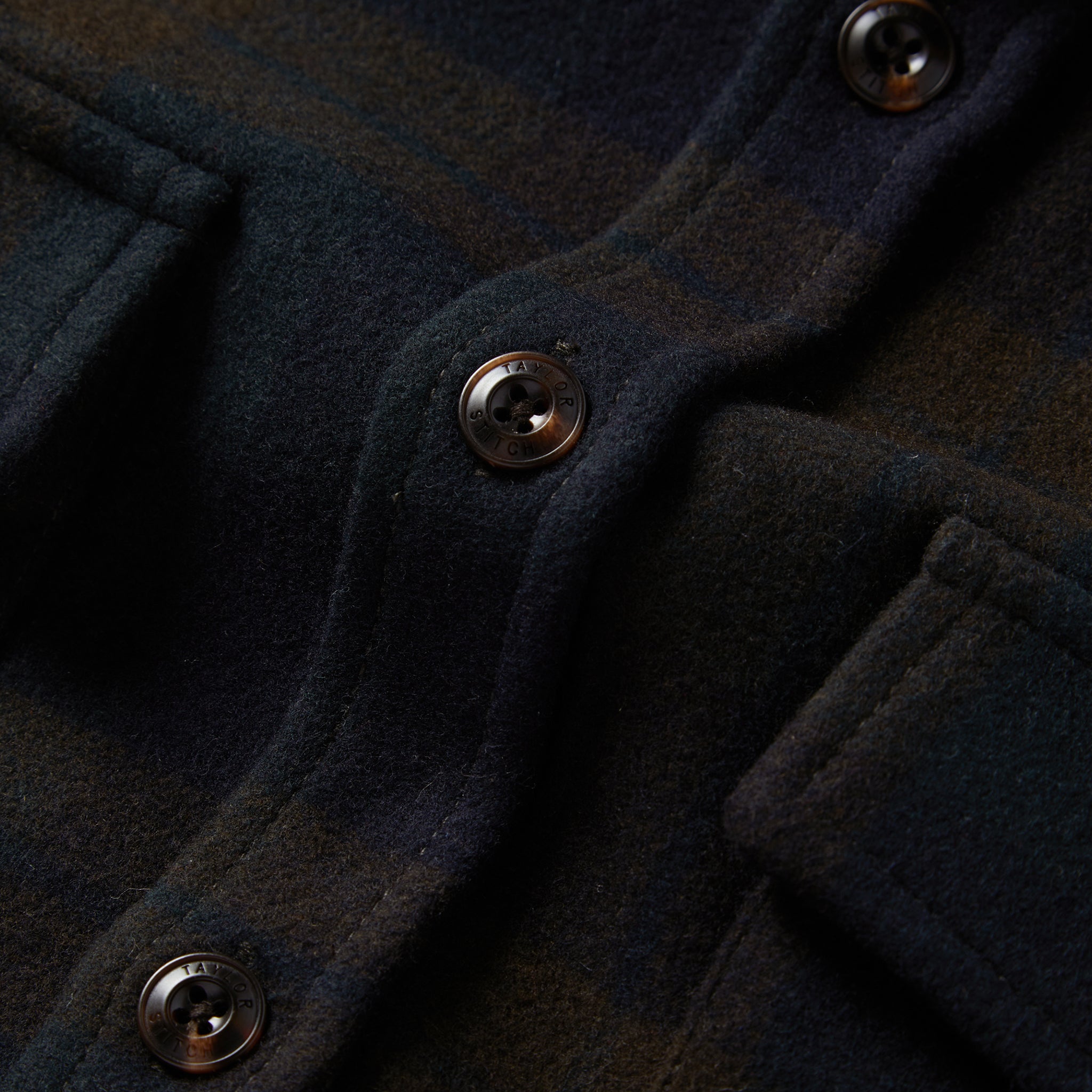material shot of the buttons on The Maritime Shirt Jacket in Pike Plaid, Wovens by Taylor Stitch