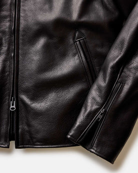 material shot of the zipper and pocket for The Moto Jacket in Black Steerhide, Outerwear by Taylor Stitch