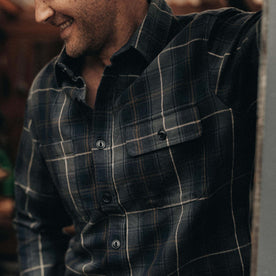 fit model showing pocket detail on The Moto Utility Shirt in Shale Plaid