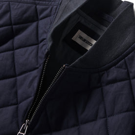 material shot of the collar on The Quilted Bomber Jacket in Navy Dry Wax