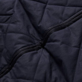 material shot of the zipper on The Quilted Bomber Jacket in Navy Dry Wax