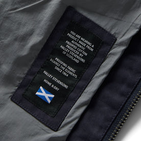 material shot of the Halley Stevensons tag on The Quilted Bomber Jacket in Navy Dry Wax