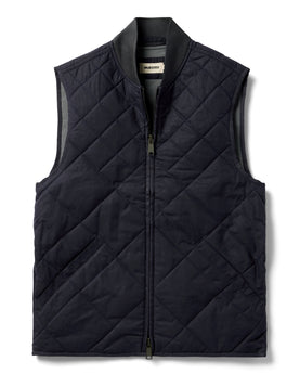 flatlay of The Quilted Bomber Vest in Navy Dry Wax, Outerwear by Taylor Stitch