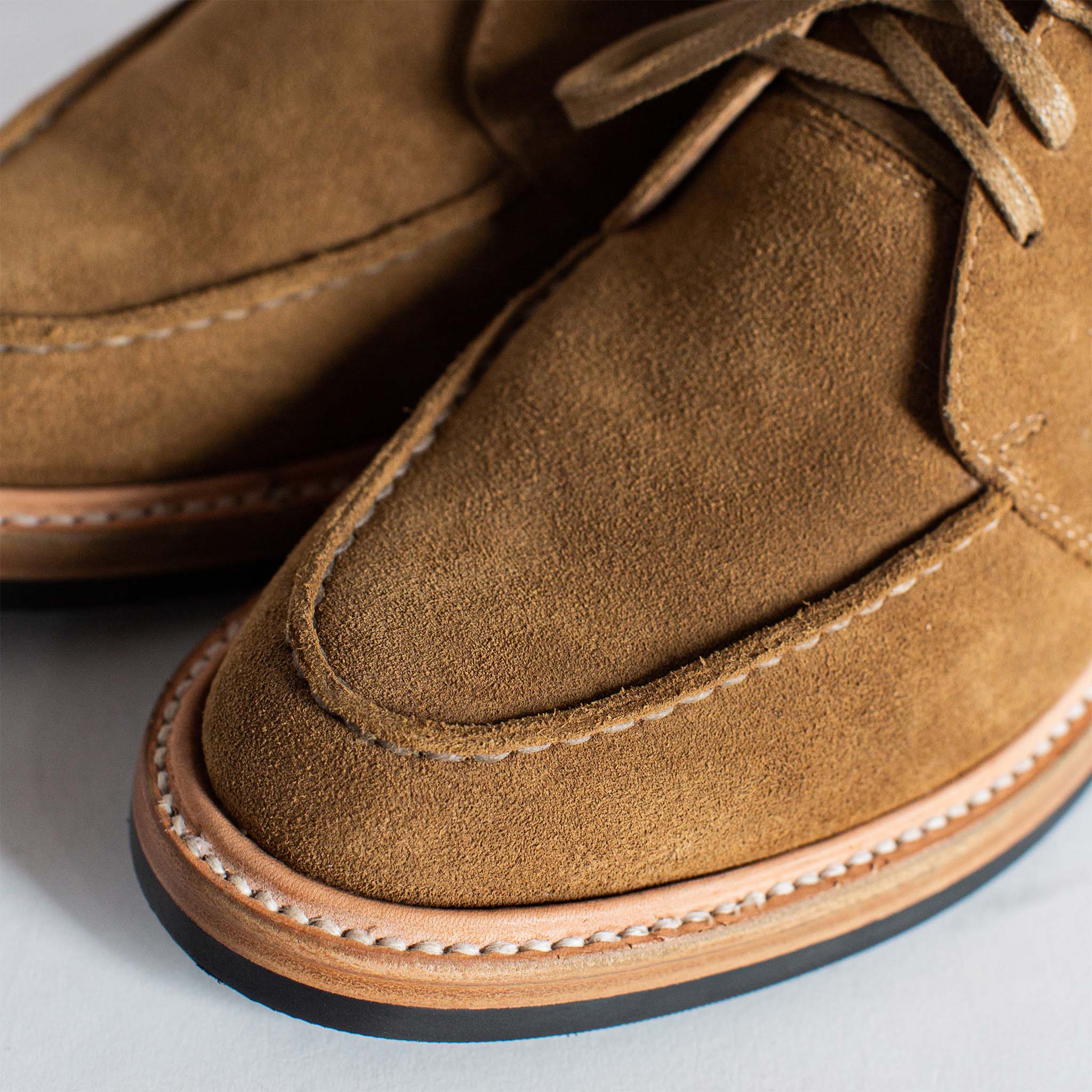 material shot of the tops of The Rambler Chukka in Mushroom Suede, Footwear by Taylor Stitch