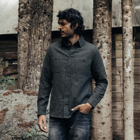 fit model posing with his hand in his pocket in The Service Shirt in Olive Melange Wool