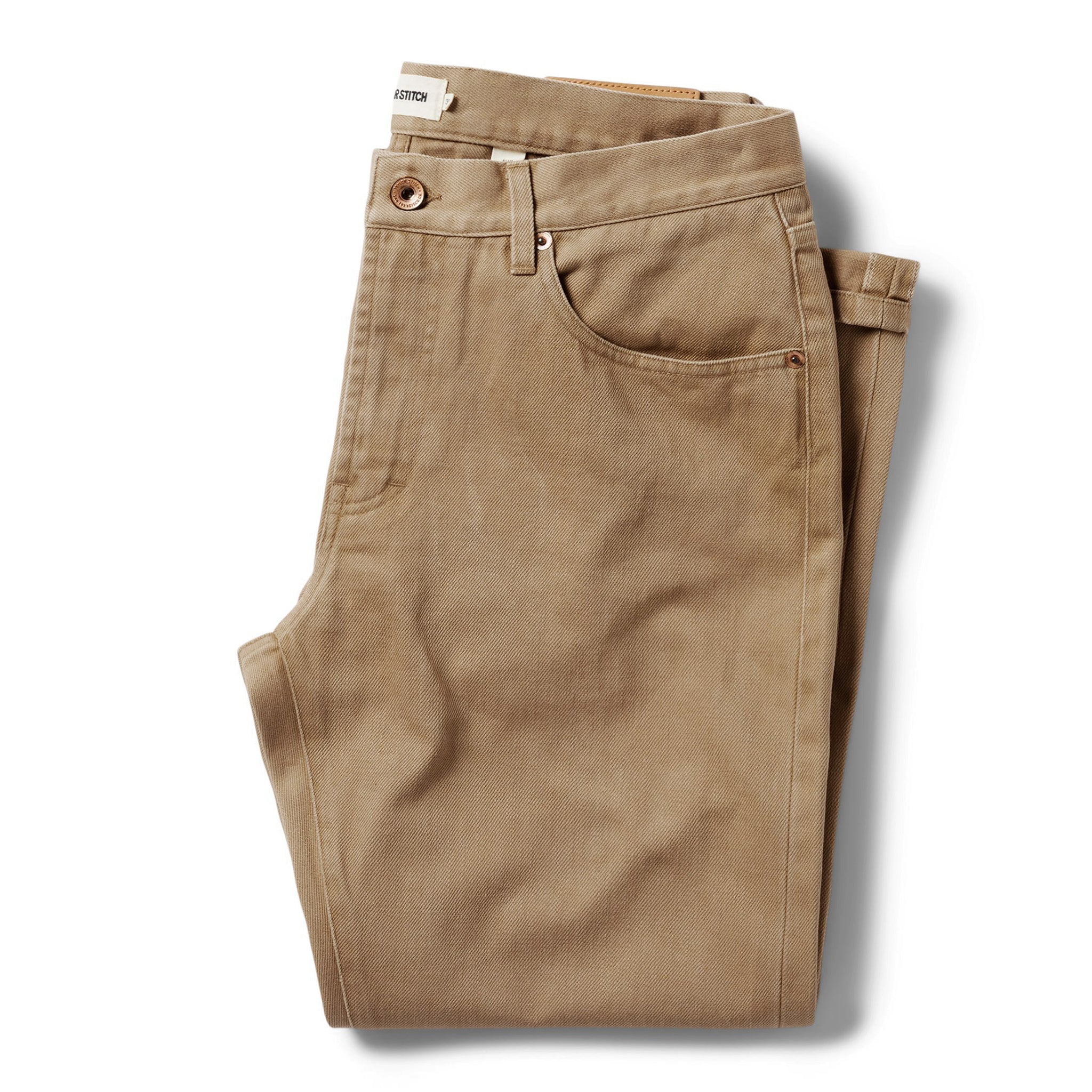 flatlay of The Slim All Day Pant in Washed Tobacco Selvage folded, Bottoms by Taylor Stitch
