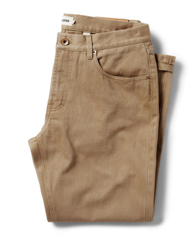 flatlay of The Slim All Day Pant in Washed Tobacco Selvage folded, Bottoms by Taylor Stitch