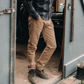 fit model posing in The Slim All Day Pant in Washed Tobacco Selvage