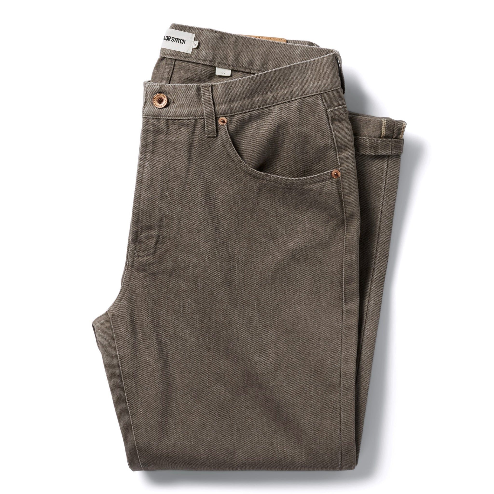 flatlay of The Slim All Day Pant in Washed Walnut Selvage folded, Bottoms by Taylor Stitch