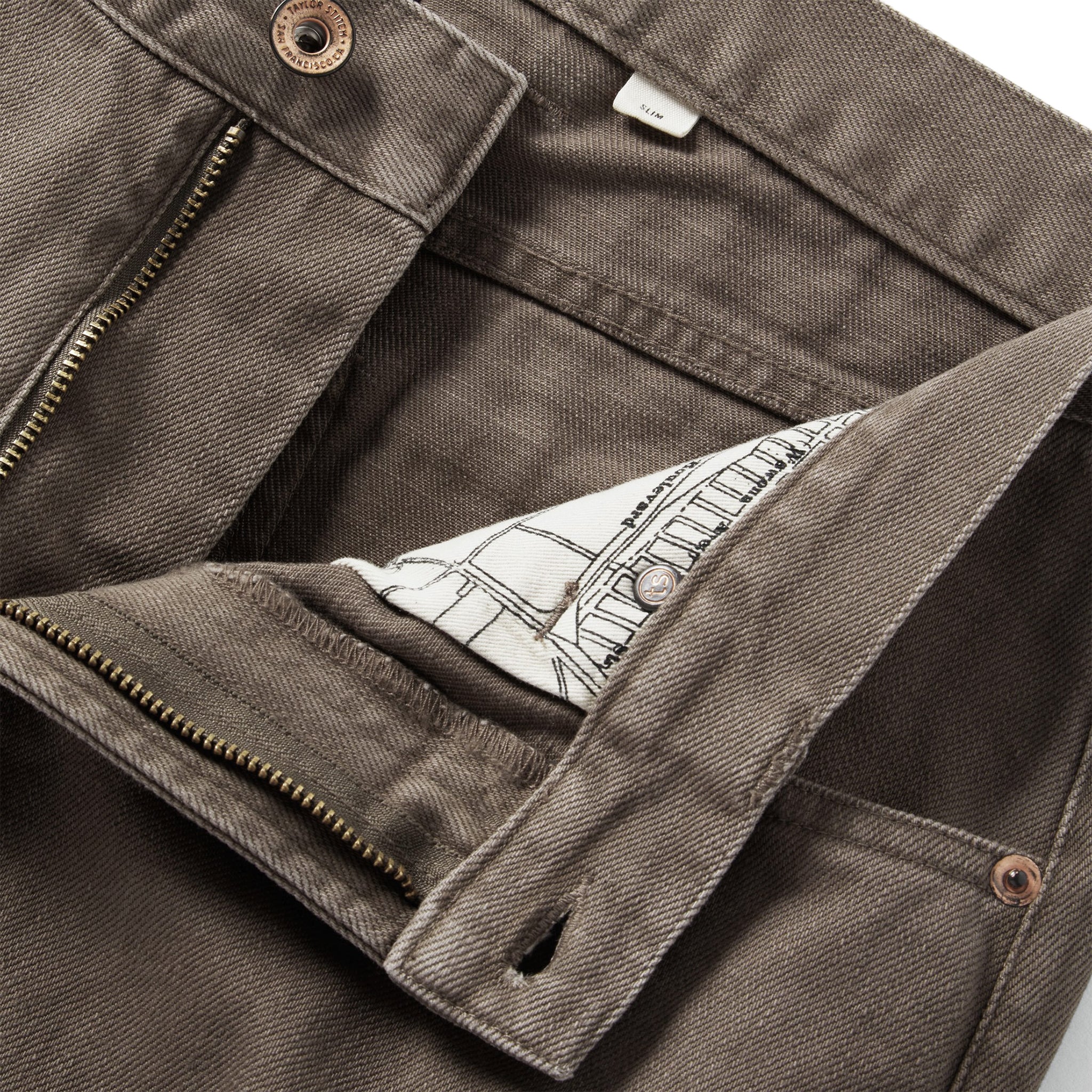 material shot of the fly on The Slim All Day Pant in Washed Walnut Selvage, Bottoms by Taylor Stitch