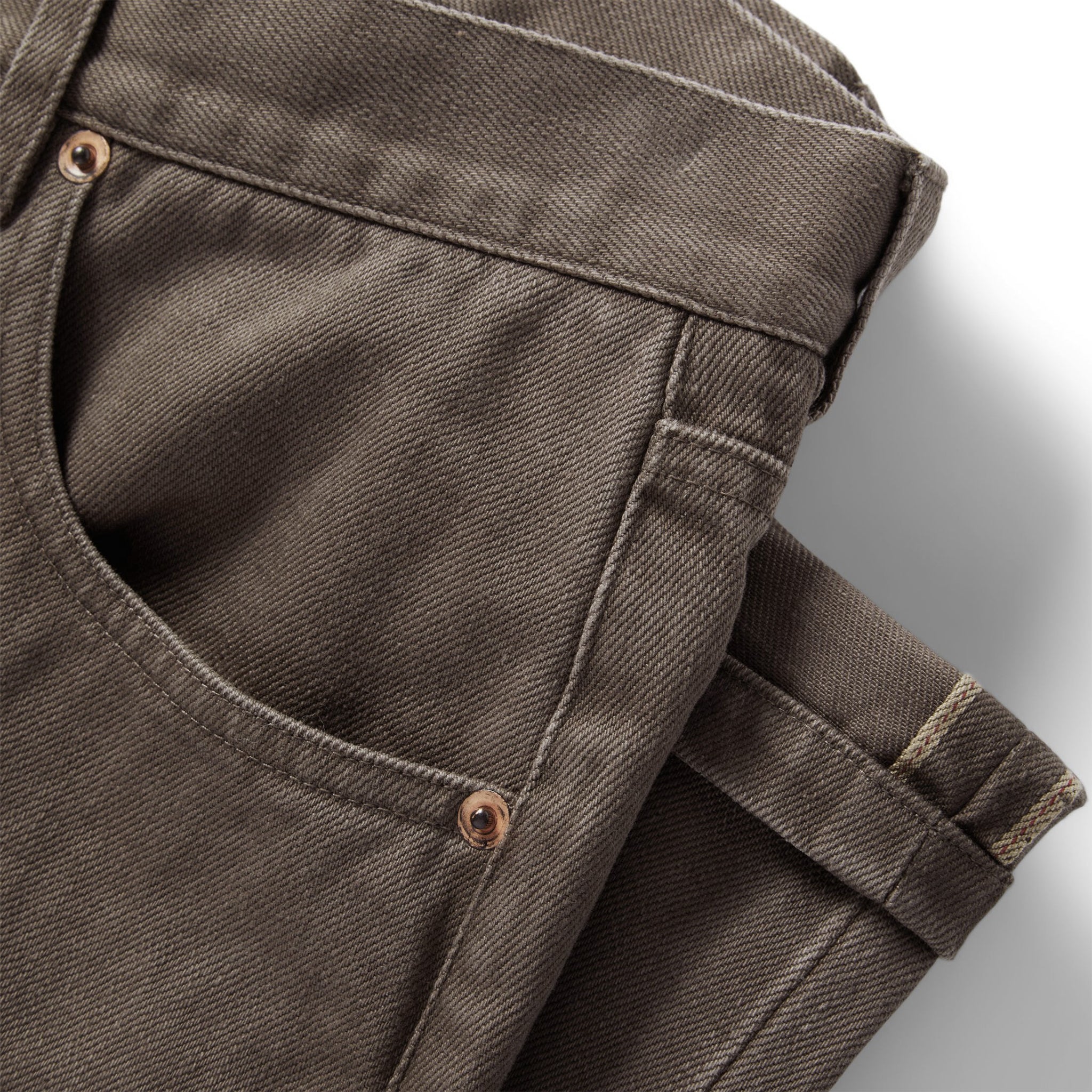 material shot of the pockets on The Slim All Day Pant in Washed Walnut Selvage, Bottoms by Taylor Stitch
