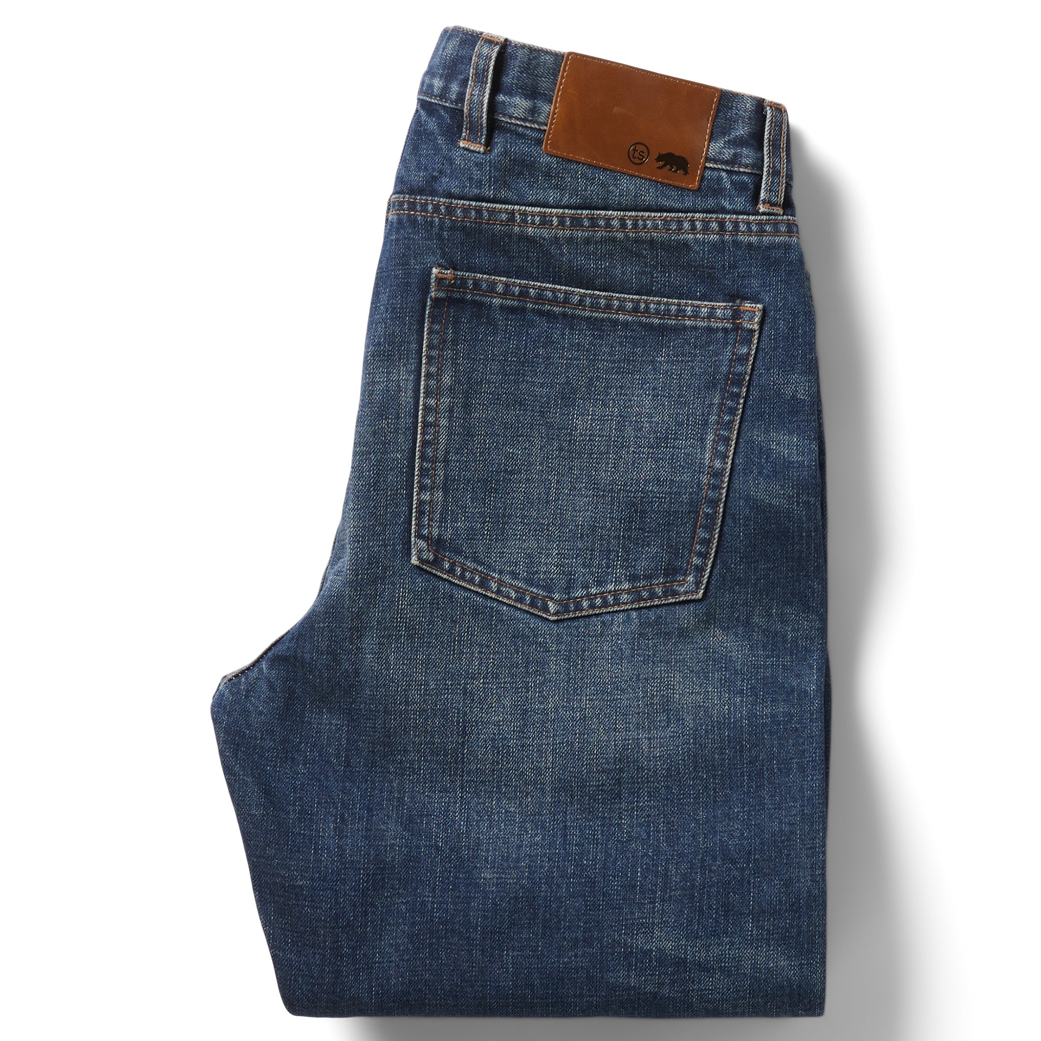 flatlay of the back of The Slim Brushed Back Jean in Sawyer Wash Organic Selvage folded, Bottoms by Taylor Stitch